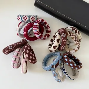 Set of 4 colorful knitted scrunchies with heart and stripe patterns for women hair