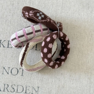 Detail of 4-piece high elastic knit hair ties with retro puppy and heart patterns