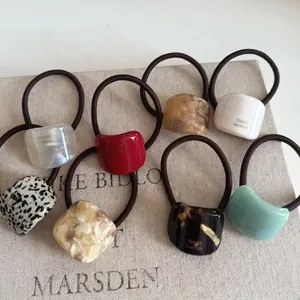 Set of 8 vintage geometric acetate hair ties with tortoiseshell and marble patterns