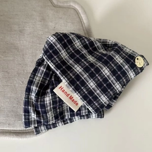 Blue and white checkered denim shark hair clip with handmade label and golden bow button