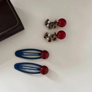 Stylish leopard print dog hair clips and navy blue BB clips with red bead accents