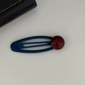 Navy blue matte snap hair clip with a burgundy round bead accessory for women