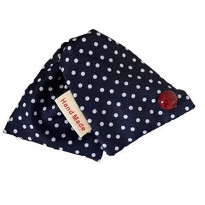 Blue denim triangle hair claw with white polka dots, red bead, and handmade label tag