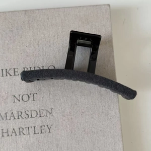 Elegant dark grey fabric-wrapped shark hair claw clip with minimalist vintage design