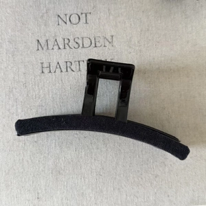 Detail showing high-quality black flocked velvet hair claw clip with rectangle frame design
