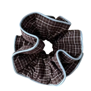 Brown checkered scrunchie with light blue piping edge for elegant ponytail hairstyles