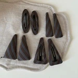 8-piece vintage striped hair clip set in brown and green fabric with geometric shapes