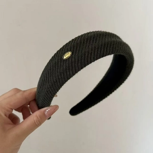 Minimalist dark grey knitted wide headband with love gold tag and ribbed texture