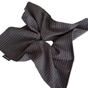 Navy blue heart striped scrunchie with handmade tag in a minimalist French style
