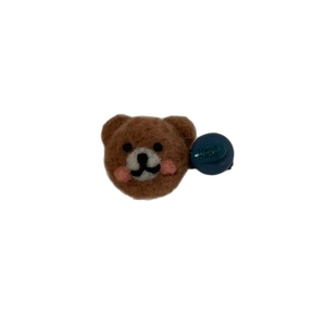Handmade brown felt bear hair clip with blue button decoration and pink blush details