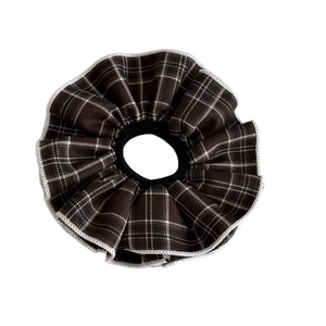 Classic plaid scrunchie with brown and white check pattern for hair styling