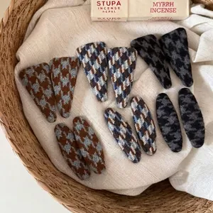Set of 12 houndstooth wool fabric hair clips in triangular and oval shapes for women
