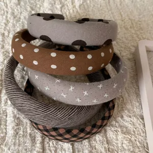Five-piece set of vintage coffee brown padded headbands with various retro patterns