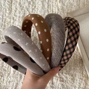 Close-up of assorted vintage fabric headbands with polka dots and plaid patterns