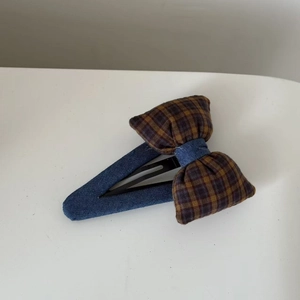 Denim blue and yellow gingham bow hair clip with vintage plaid pattern on white background