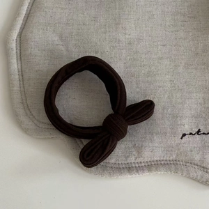 Vintage dark brown bow scrunchie made of soft pleated fabric for women hair styling