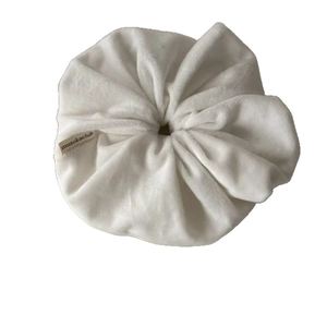 Elegant white velvet oversized hair scrunchie with musokaclub label for ponytails