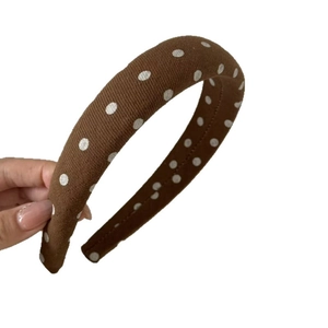 Retro brown polka dot headband with thick fabric texture and wide high-top design