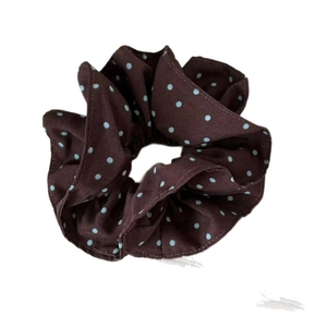 Brown scrunchie with blue polka dots made of soft cotton fabric for ponytails