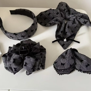 Detailed set of grey plaid hair accessories including headband, bow, and hair claw clip