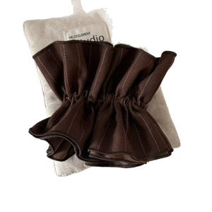 Maillard brown striped fabric hair scrunchie with pleated texture and elastic center