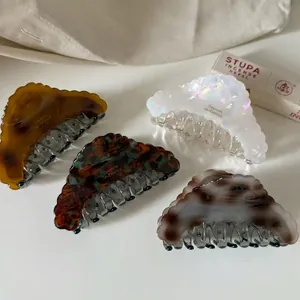 French design acetate hair claws in tortoise shell and marble patterns for women
