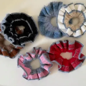 Colorful knitted scrunchies with striped pattern and ruffled edges for women hair styling