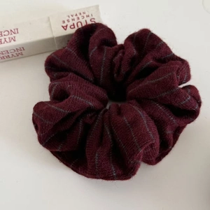 Deep red knitted striped scrunchie hair tie for women with thick wool texture