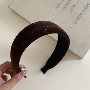 Close-up of brown velvet polka dot wide headband with anti-slip inner lining