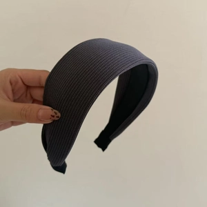 Close-up of the dark grey knitted ribbed fabric texture and anti-slip lining on the headband