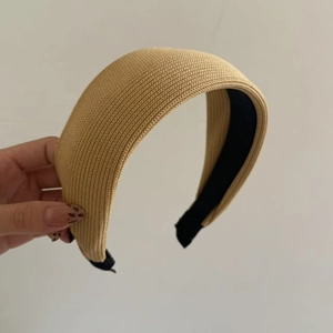 Detail of the khaki knitted fabric headband showing a wide sponge padded design