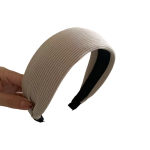 Beige ribbed knit wide headband for women featuring high top style and non-slip lining