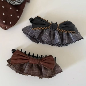 Retro bow hair clips with plaid ruffles in black and brown faux leather styling