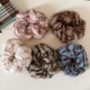 Plush faux fur scrunchie set in five colors including leopard print for women's hair styling