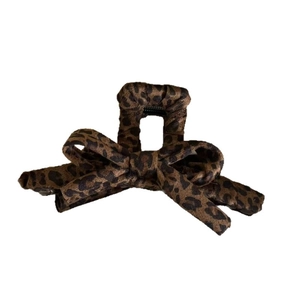 Elegant leopard print bow hair claw clip for women featuring brown and black animal patterns