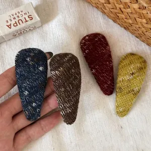 Set of four handmade knitted water drop hair clips in deep blue, brown, red and yellow colors