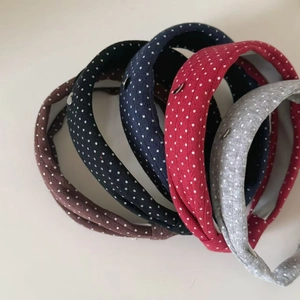 Vintage polka dot knitted headbands in four colors featuring a stylish knot design