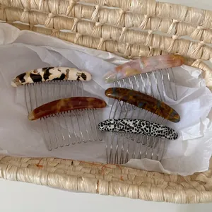 Five assorted marble patterned acetate hair side combs with metal teeth for women