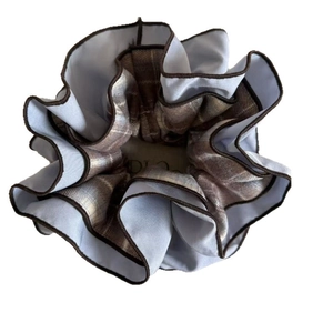 Blue and brown double-layered checkered scrunchie with elegant pleated fabric texture