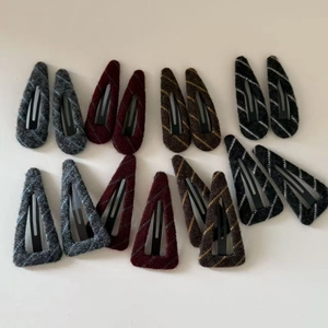 14-piece set of knitted pattern BB hair clips in various dark colors and shapes