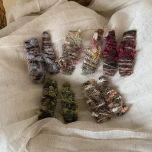 Detail of wool knit hair clips set featuring varied textures and vintage autumn colors