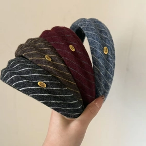 Retro knitted wide headband set in four colors with handmade golden metal tag
