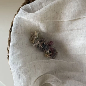 Detailed view of handmade colorful plush yarn texture on a sweet Korean style hair clip
