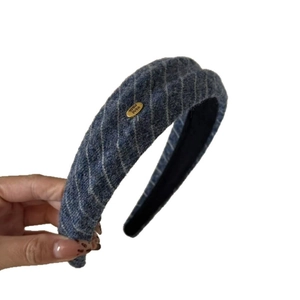 Retro knit wide headband in dark grey-blue stripes with handmade golden metal tag