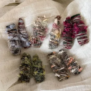 Set of 6 colorful knitted plush hair clips with vintage woven texture on cotton background