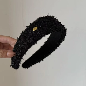 Detail of tweed headband with golden metal tag and Hand Made engraving for hair