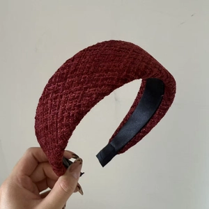 Close-up of burgundy tweed braided headband featuring a soft black satin lining