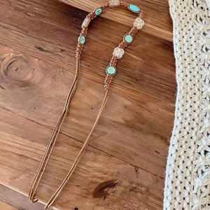 Bohemian brown braided strap with blue totem beads and white floral charms