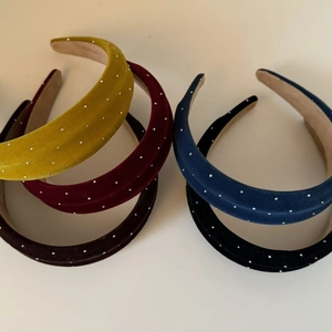 Velvet padded headbands with rhinestones in yellow, red, blue, and black colors