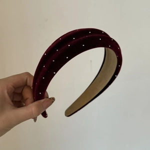Close-up of wine red velvet headband with sparkling silver rhinestones and anti-slip lining